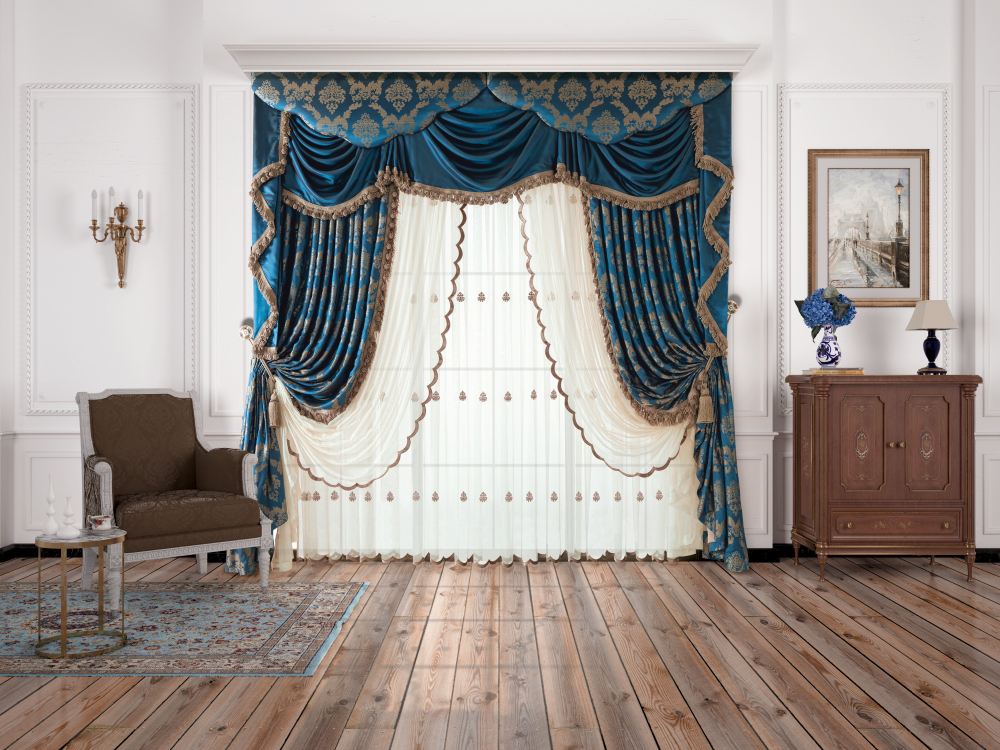 Classic living room with blue and gold luxury draped curtains, sheer embroidered panels, wooden flooring, vintage armchair, side table, and decorative cabinet.