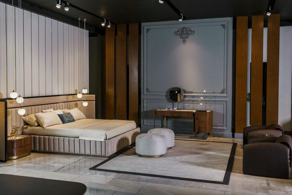 Modern Furniture in Pakistan showing a contemporary bedroom with upholstered bed, soft lighting, and minimalist interior design