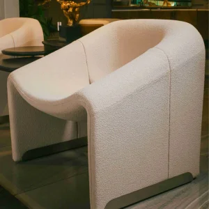 Elegant modern sofa chair with curved design by NM Furnisher, part of premium luxury furniture in Pakistan