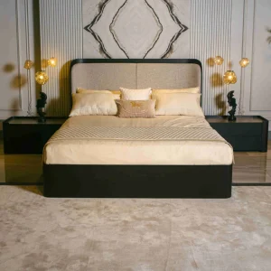 Elegant luxury bed with upholstered headboard and gold lighting by NM Furnisher, showcasing luxury furniture in Pakistan