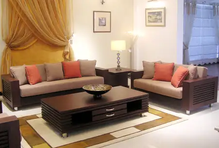 modern wooden sofa set design in Pakistan with fabric cushions and wooden center table in living room