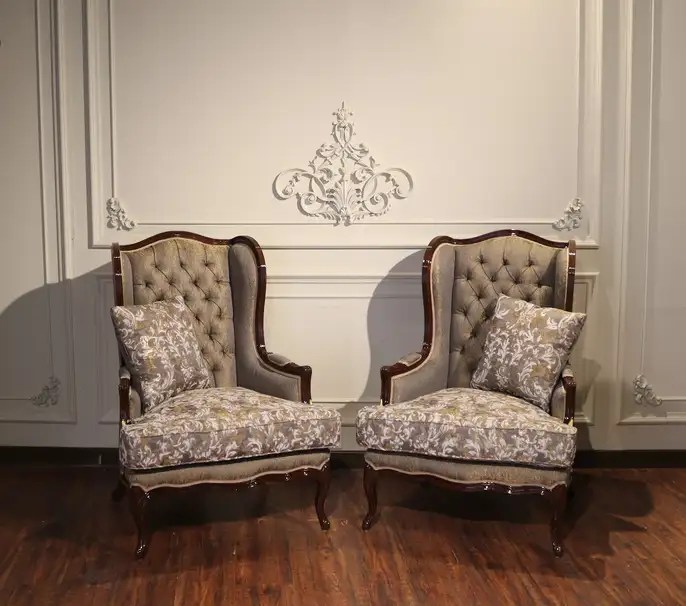 classic wingback accent chair design in Pakistan with fabric upholstery and wooden legs for elegant living room