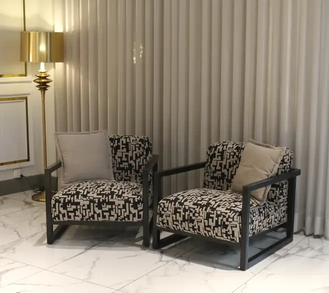 modern metal frame accent chair design in Pakistan with patterned fabric cushions for living room
