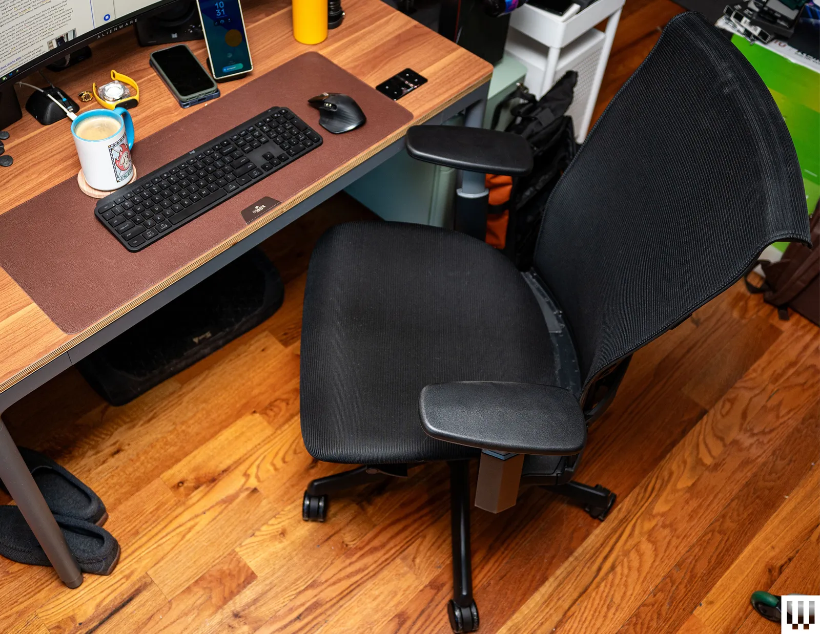 adjustable computer office chair Pakistan with mesh backrest placed near office desk setup